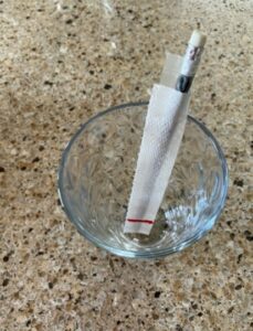 pencil taped to paper towel to keep it upright in a glass